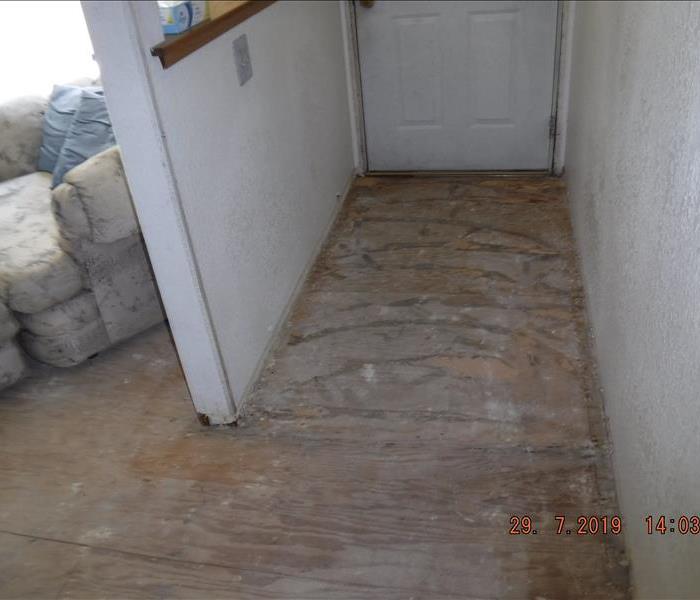 Entry way dried out and flooring removed down to sub floor.
