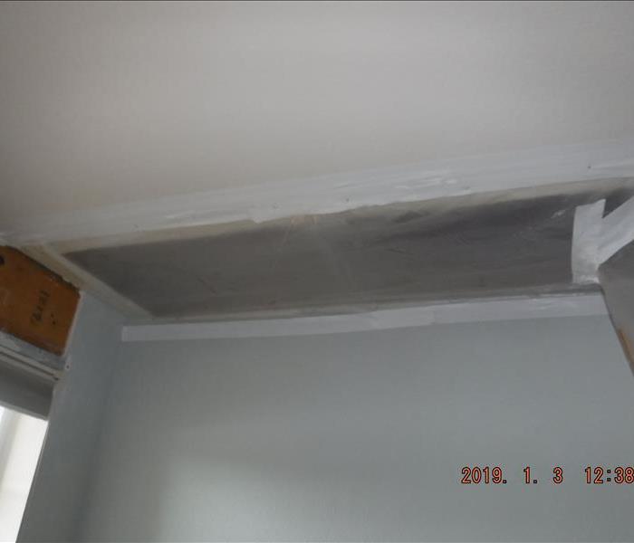 Plastic and taped area in ceiling