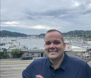Water view of Gig Harbor, and man smiling